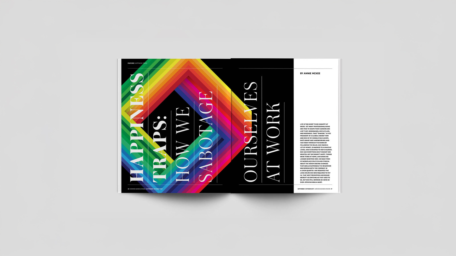 An image of a magazine opened to a spread with a large black square. On the black square is an imposible shape with a of rainbow colors. The design was made in Adobe Illustrator and Indesign.