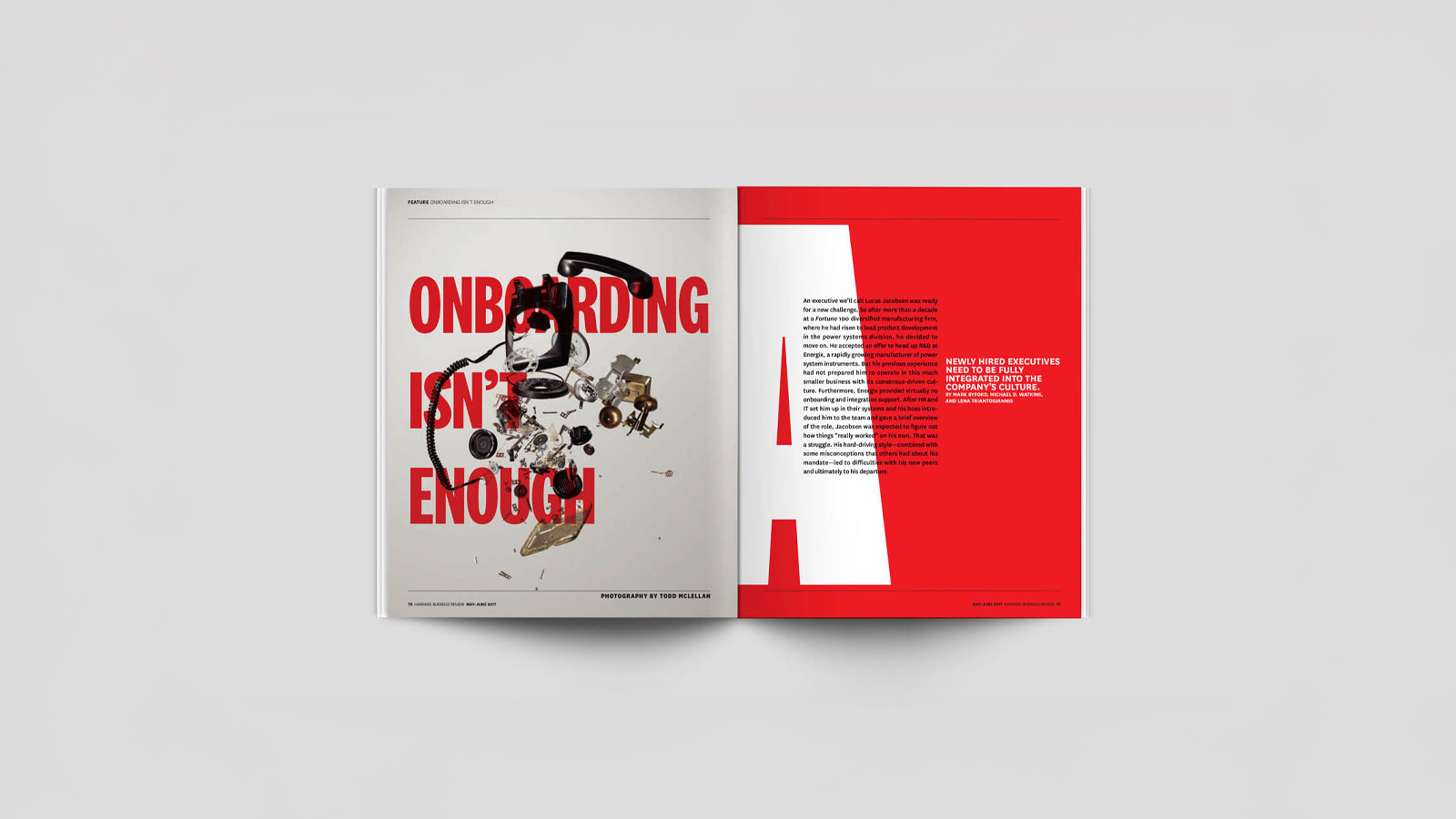 An image of a magazine opened to a spread. the left page of the spread has a rotary phone exploded in the air with red typography layered ontop of the phone. Right side of the spread is red and has a large White A with typography layered on top. Made in Adobe Indesign