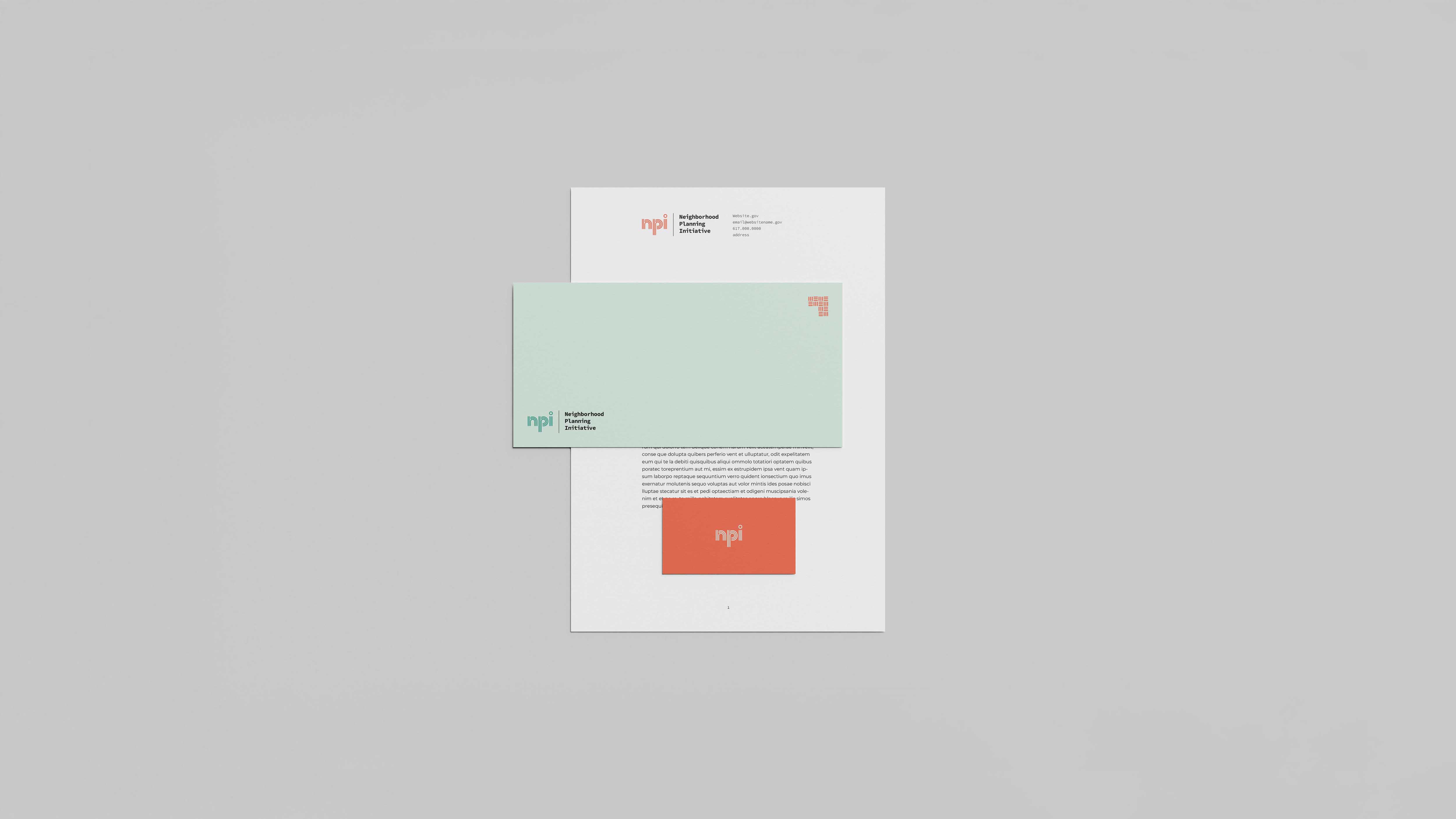 An image of a light green envelope, an orange business card, and white sheet of paper on a gray background. each has a logo of the letter forms N P I on them. design made in Adobe Indesign and Illustrator.